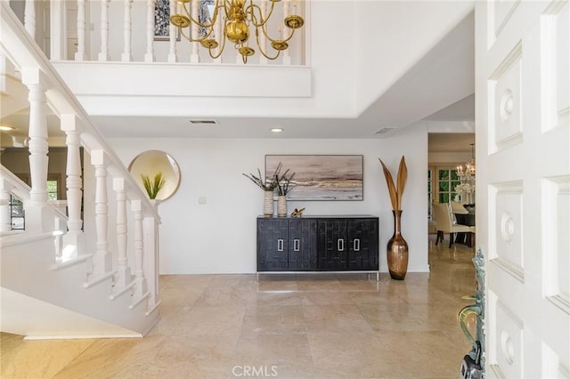 foyer entrance featuring a chandelier