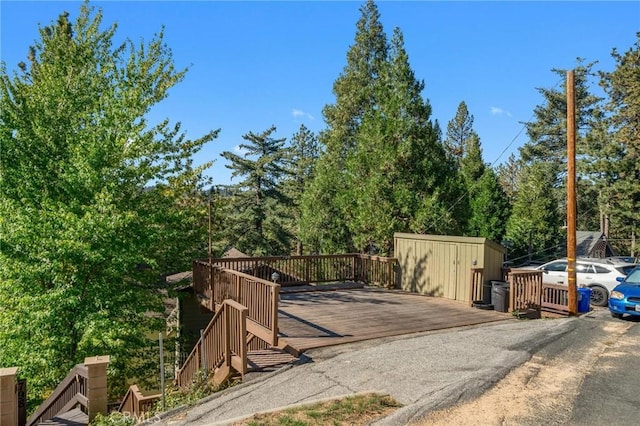 view of gate with a wooden deck