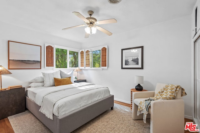 bedroom featuring light wood-type flooring and ceiling fan