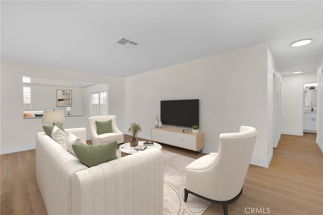 living room with light hardwood / wood-style flooring