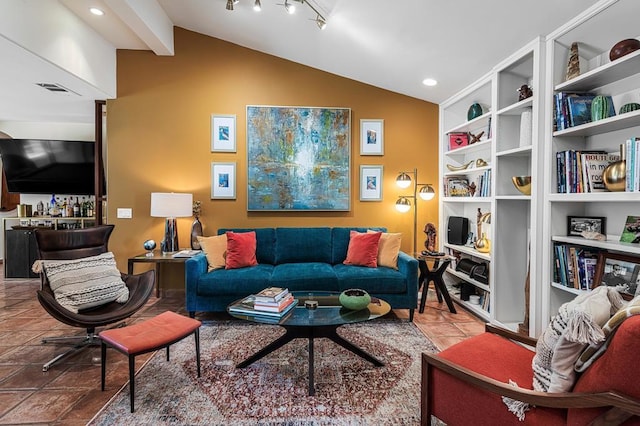 living room with lofted ceiling and rail lighting