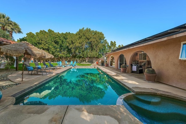 view of swimming pool with a patio area