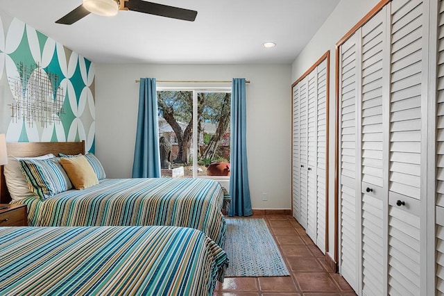 tiled bedroom with ceiling fan