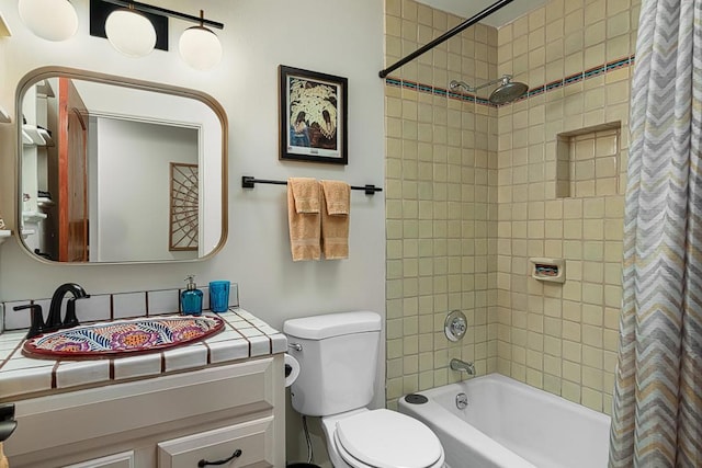 full bathroom featuring vanity, shower / tub combo, and toilet