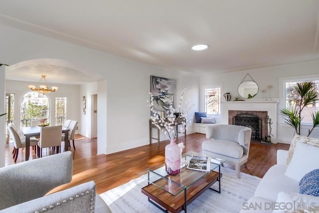 living room featuring hardwood / wood-style floors and a notable chandelier