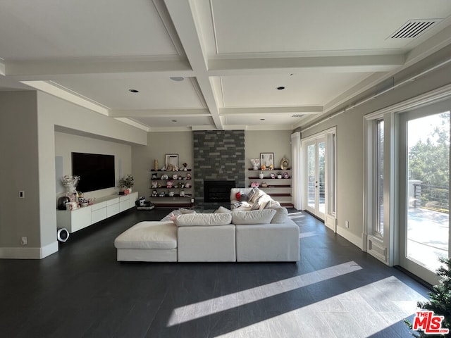 living room with a large fireplace, crown molding, beam ceiling, and coffered ceiling