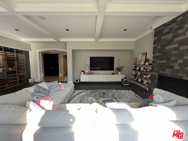 living room with beamed ceiling and coffered ceiling