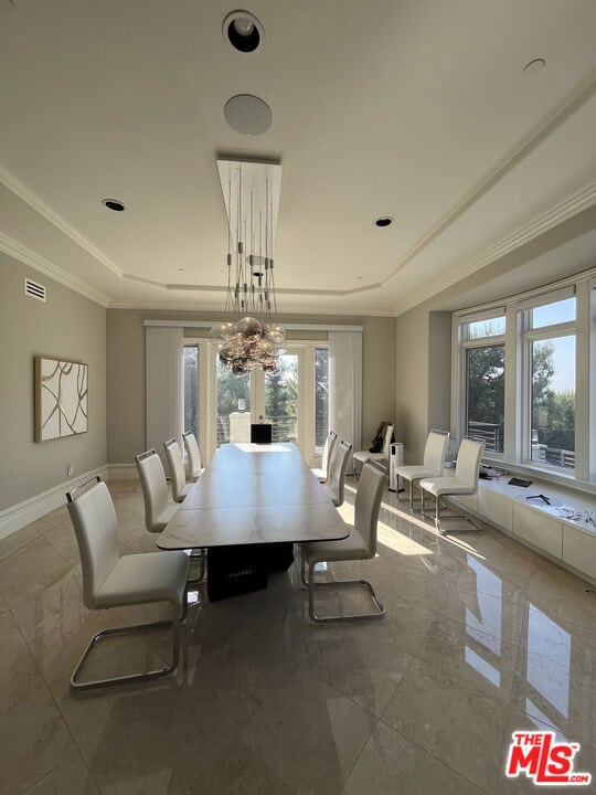 dining room featuring a chandelier and ornamental molding