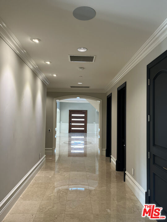 corridor with crown molding