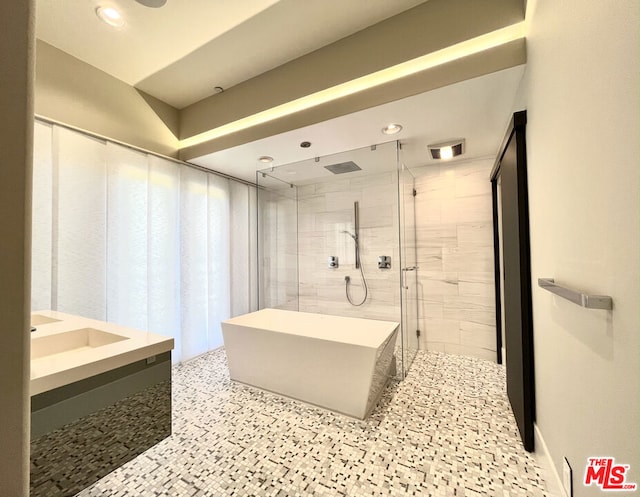 bathroom with independent shower and bath