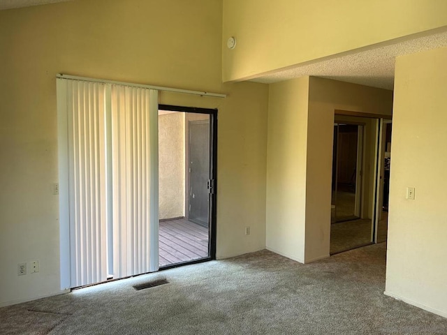 unfurnished room with carpet floors