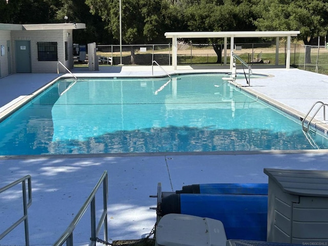 view of swimming pool with a patio area