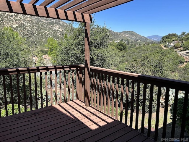 wooden terrace with a mountain view