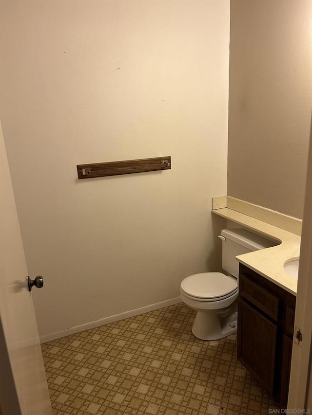 bathroom with toilet and vanity