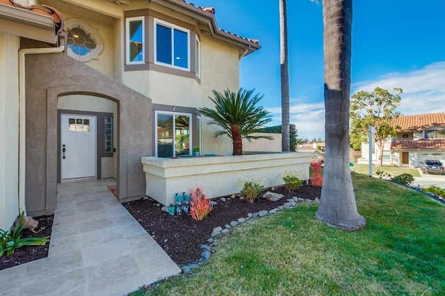 entrance to property with a yard