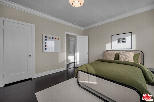 bedroom featuring crown molding and dark hardwood / wood-style flooring