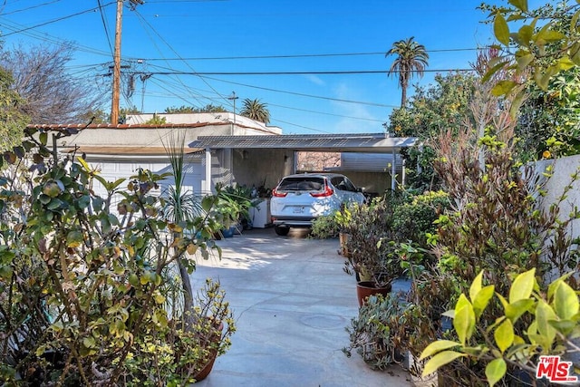 exterior space featuring a garage and a carport