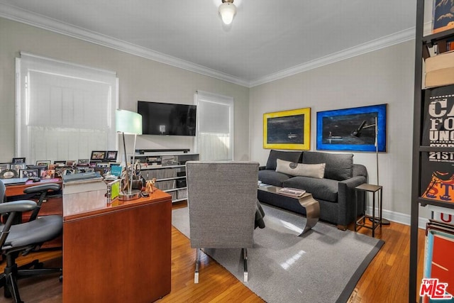 home office featuring hardwood / wood-style floors and ornamental molding