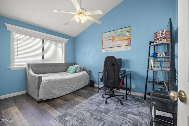 bedroom with ceiling fan, dark wood-type flooring, and lofted ceiling