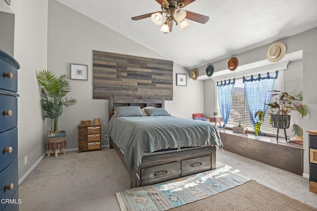 bedroom featuring ceiling fan, light carpet, and lofted ceiling