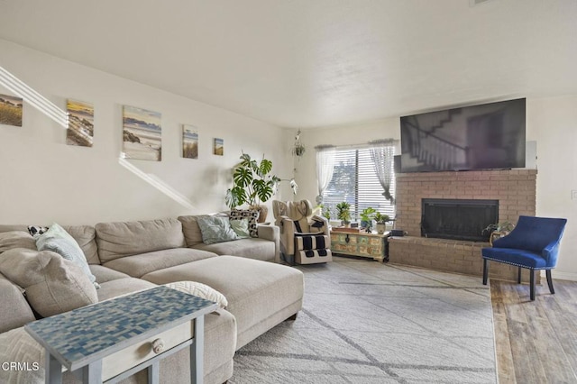 living room with a fireplace and hardwood / wood-style floors