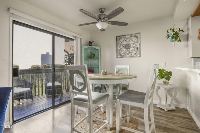 dining space with ceiling fan and hardwood / wood-style floors