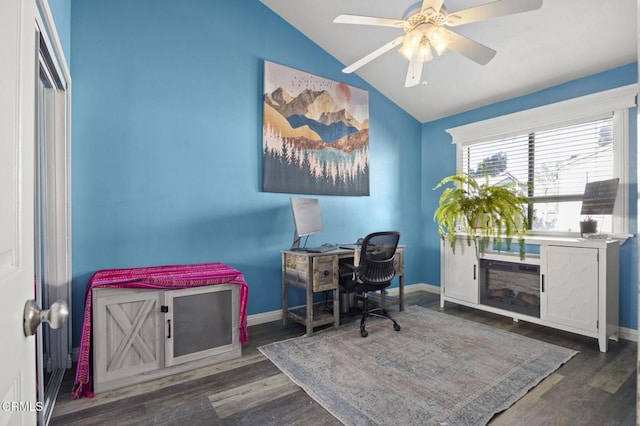 home office with vaulted ceiling, ceiling fan, and dark wood-type flooring