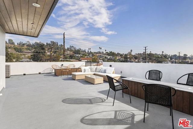 view of patio / terrace featuring exterior bar and outdoor lounge area