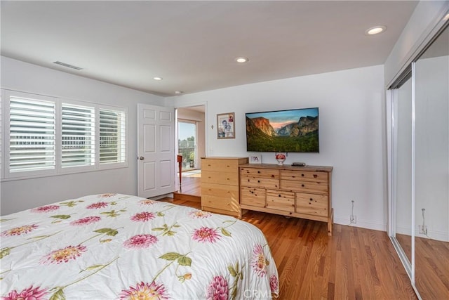 bedroom featuring a closet and wood-type flooring