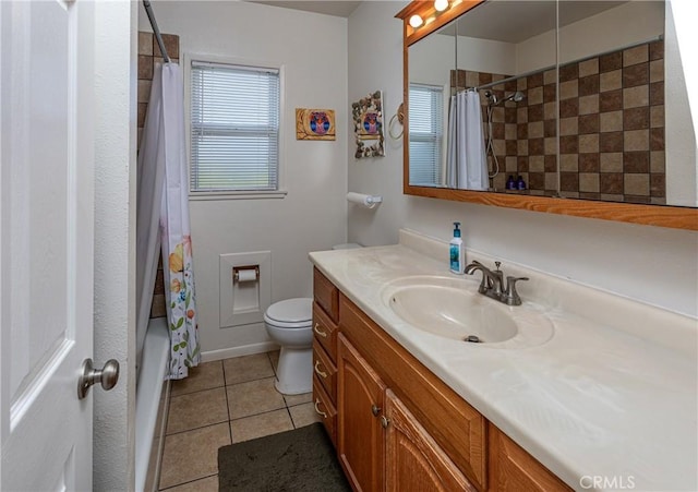 full bathroom featuring toilet, vanity, shower / bath combo, and tile patterned flooring