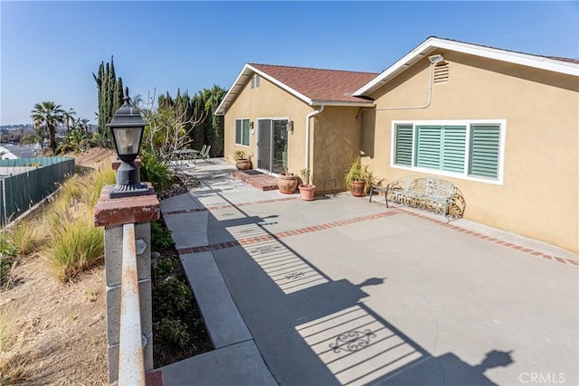 back of property featuring a patio