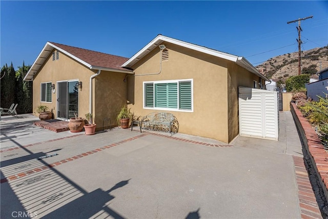 rear view of house featuring a patio area