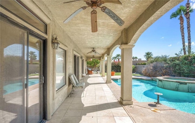 view of pool featuring an in ground hot tub and a patio area