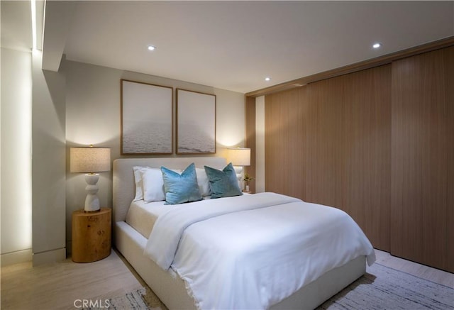 bedroom with light hardwood / wood-style flooring