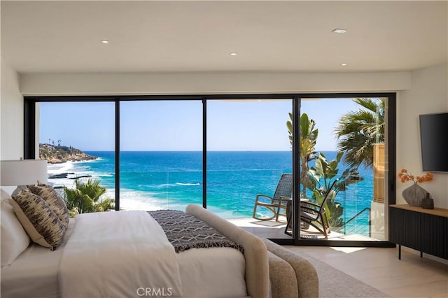 bedroom featuring a water view