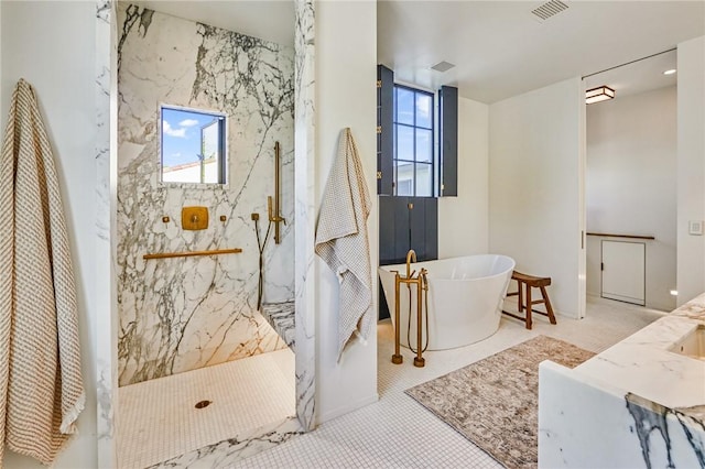 bathroom featuring vanity, shower with separate bathtub, and tile patterned flooring