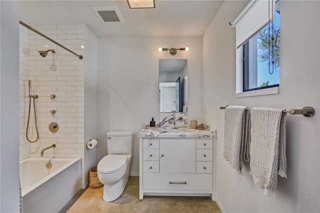 full bathroom with toilet, vanity, and tiled shower / bath combo