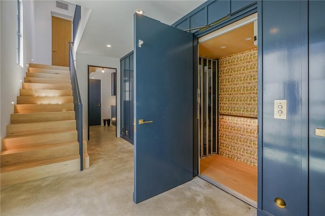 hallway with brick wall and elevator