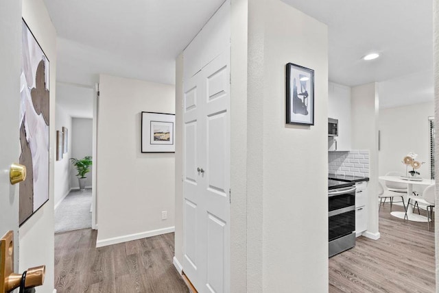 hallway featuring light hardwood / wood-style flooring