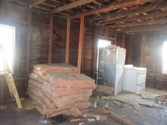 miscellaneous room with a wealth of natural light and washer / clothes dryer