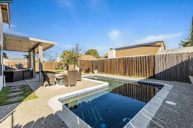 view of pool featuring a patio area