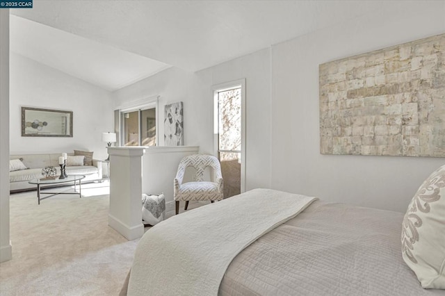 carpeted bedroom with vaulted ceiling