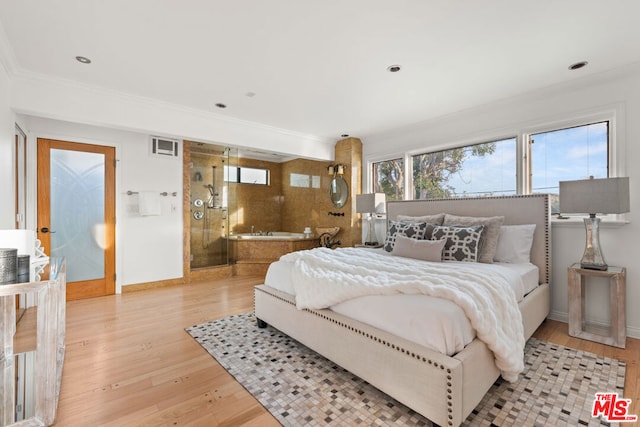 bedroom with crown molding and light wood-type flooring