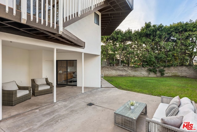 view of patio / terrace with an outdoor living space and a balcony