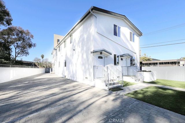 rear view of property with a yard