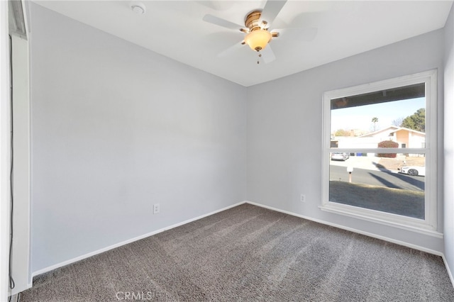 carpeted empty room with ceiling fan