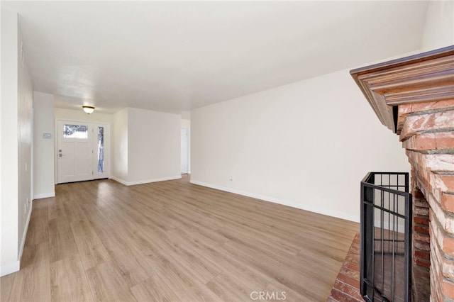 unfurnished living room with light hardwood / wood-style flooring