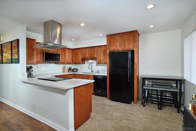 kitchen featuring black appliances, light carpet, sink, kitchen peninsula, and island range hood