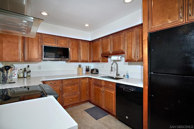 kitchen with sink, black appliances, and island exhaust hood