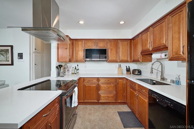 kitchen with sink, island range hood, and appliances with stainless steel finishes